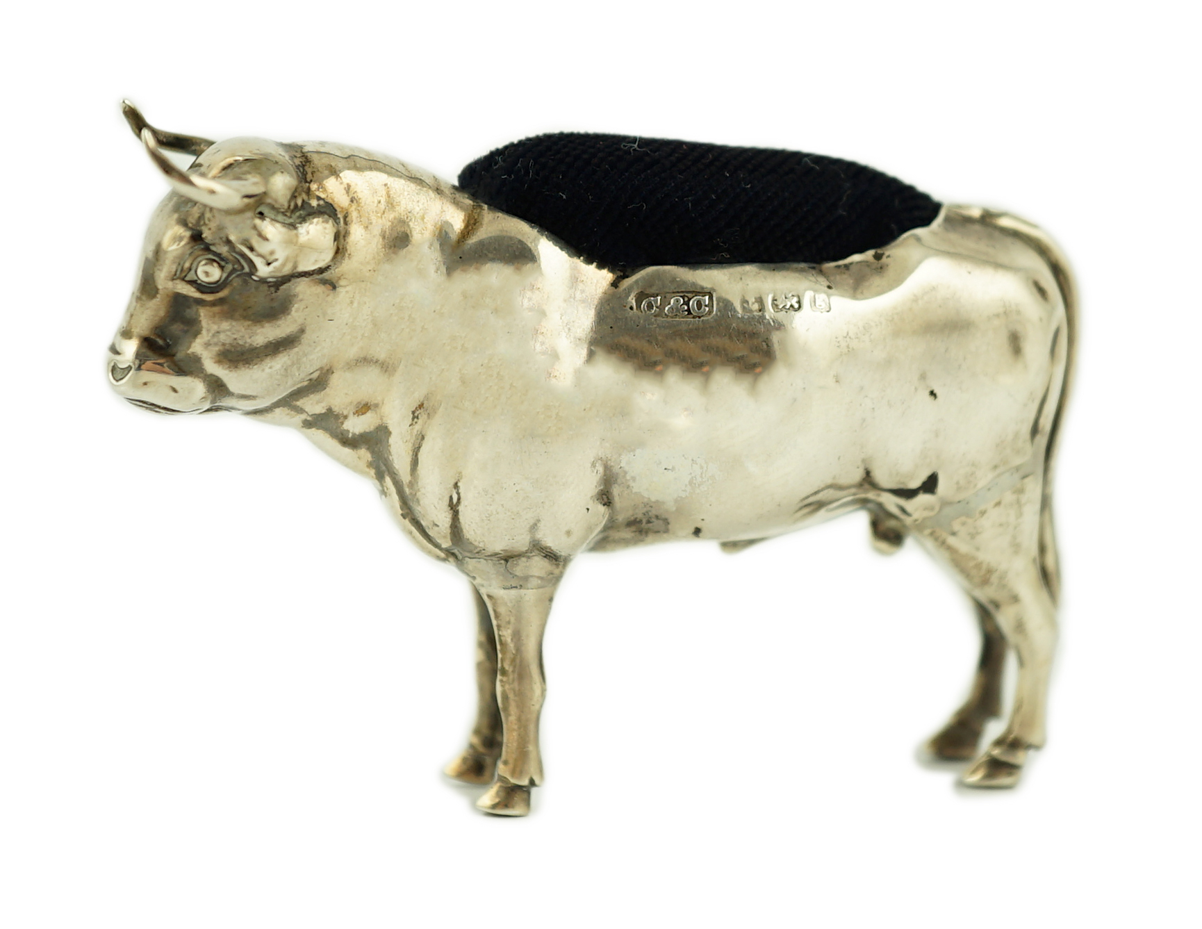An Edwardian novelty silver pin cushion, modelled as a bull, Cohen & Charles